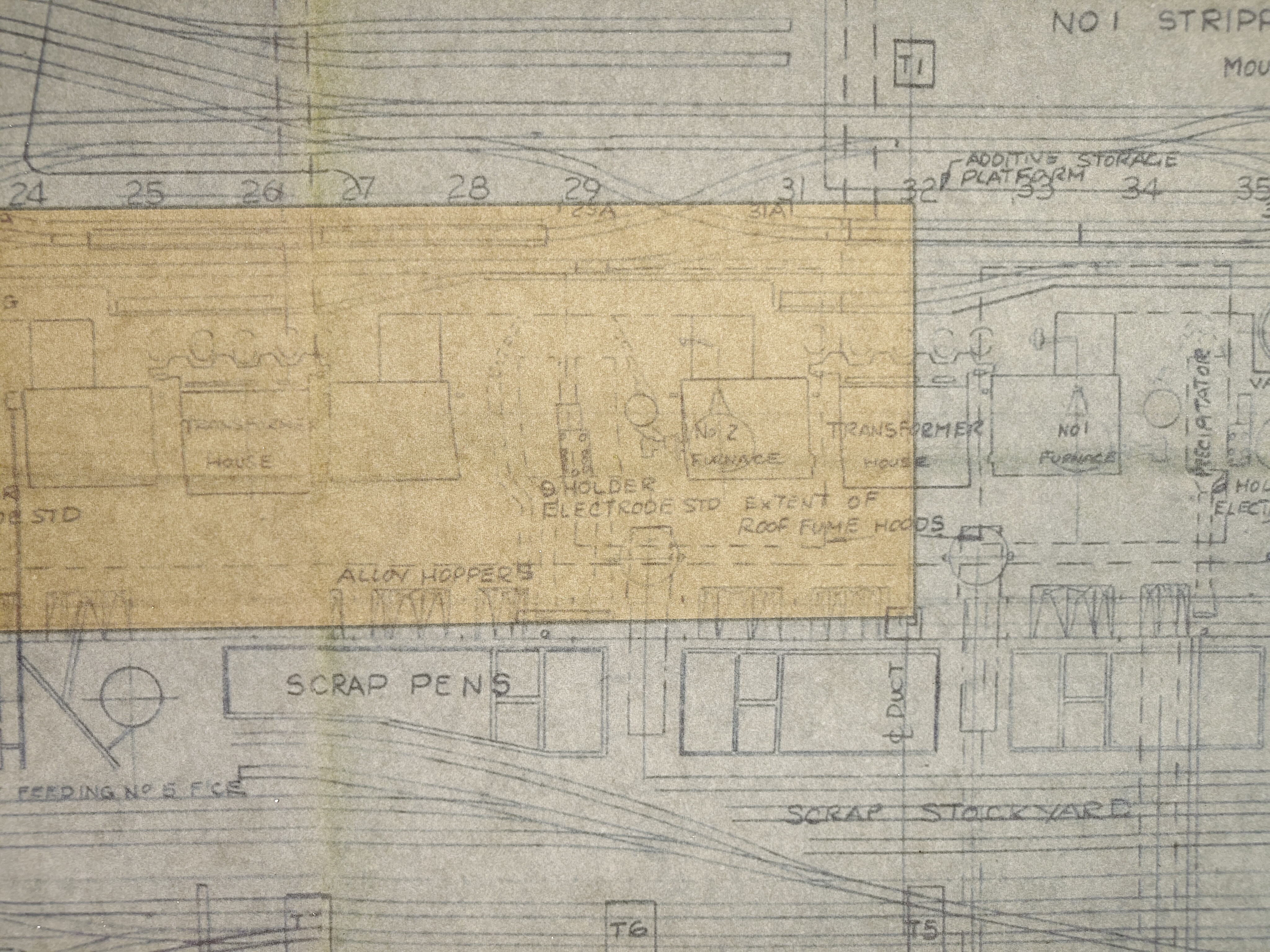 Schematics showing part of the Templeborough steelworks in Rotherham. Marked out within the main building in faint grey rectangles are things labelled 'alloy hoppers' and 'No.2 Furnace', and the main building is sandwiched by waves of lines marking train tracks.